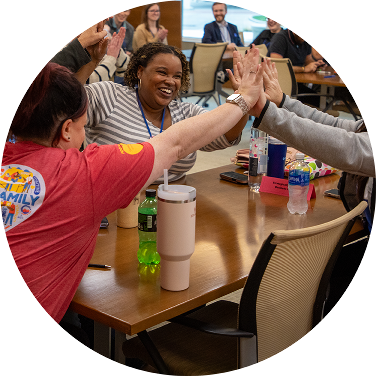 Team members giving each other high fives