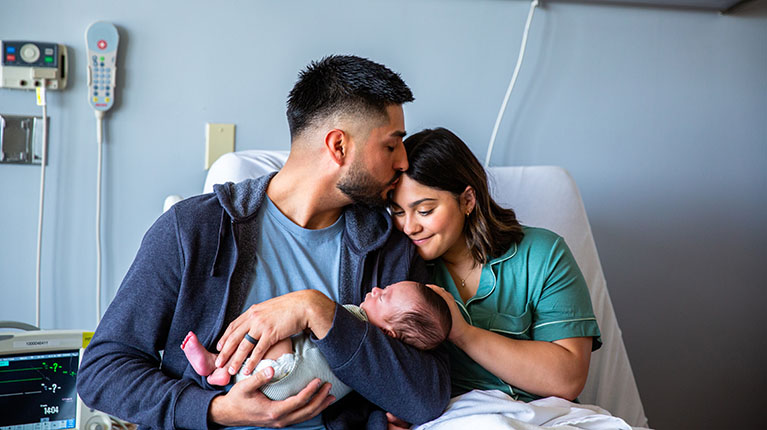 Family holding new baby