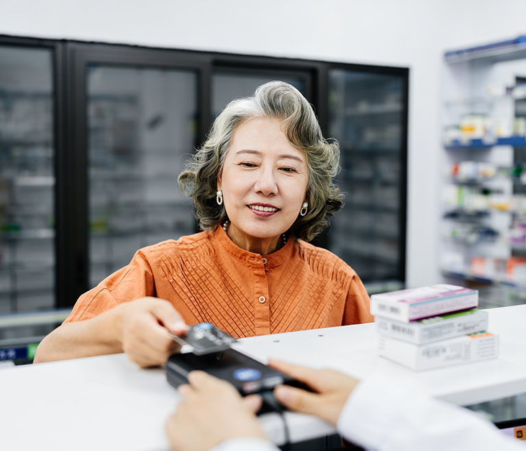 Woman paying for medication
