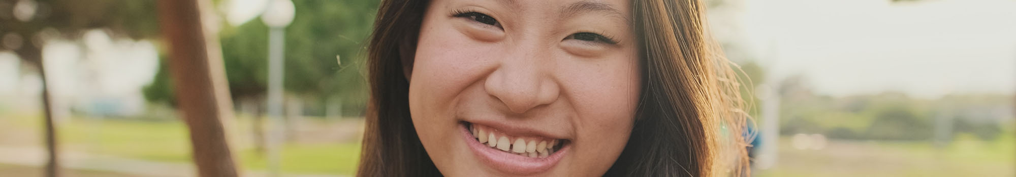 Woman smiling in a park