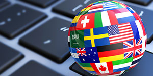 Ball with foreign flags on a computer keyboard.