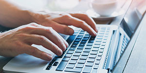Person typing on computer