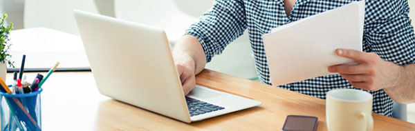 Man using a laptop on a desk