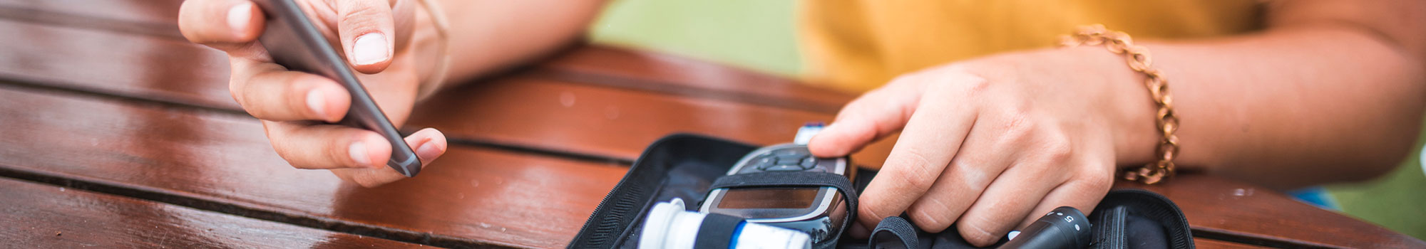 Woman logging her blood sugar into her diabetes tracking app.