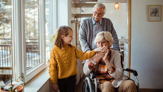 Close up of a multi generational family enjoying time together at home during the winter