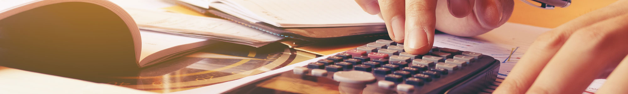Person clicking a calculator to calculate costs.